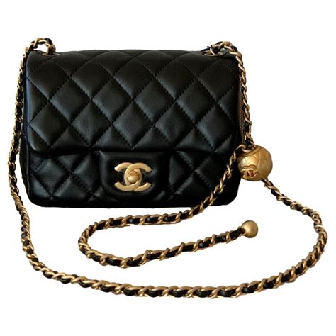 small chanel purse|Chanel small bag with chain.